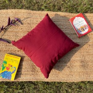 Upcycled cushion made from repurposed fabrics, eco-friendly and sustainable home décor accent piece.