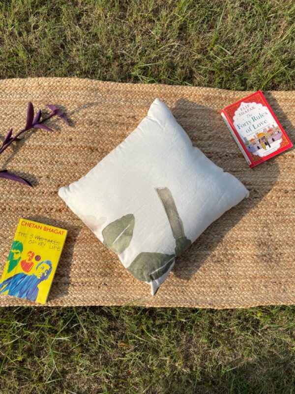 Upcycled cushion made from repurposed fabrics, eco-friendly and sustainable home décor accent piece.