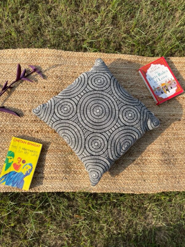 Upcycled cushion made from repurposed fabrics, eco-friendly and sustainable home décor accent piece.