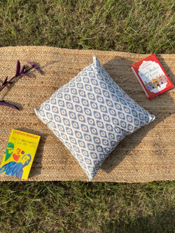 Upcycled cushion made from repurposed fabrics, eco-friendly and sustainable home décor accent piece.