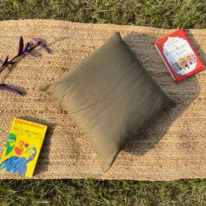 Upcycled cushion made from repurposed fabrics, eco-friendly and sustainable home décor accent piece.