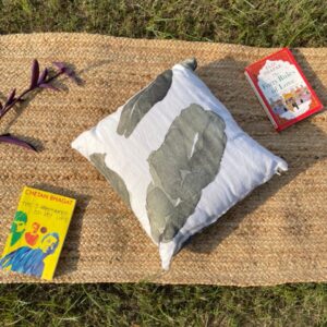 Upcycled cushion made from repurposed fabrics, eco-friendly and sustainable home décor accent piece.