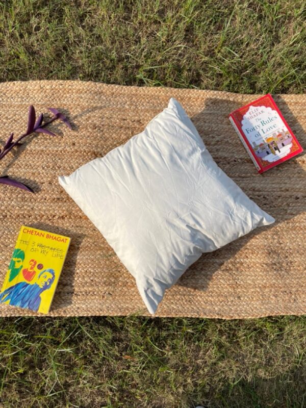 Upcycled cushion made from repurposed fabrics, eco-friendly and sustainable home décor accent piece.