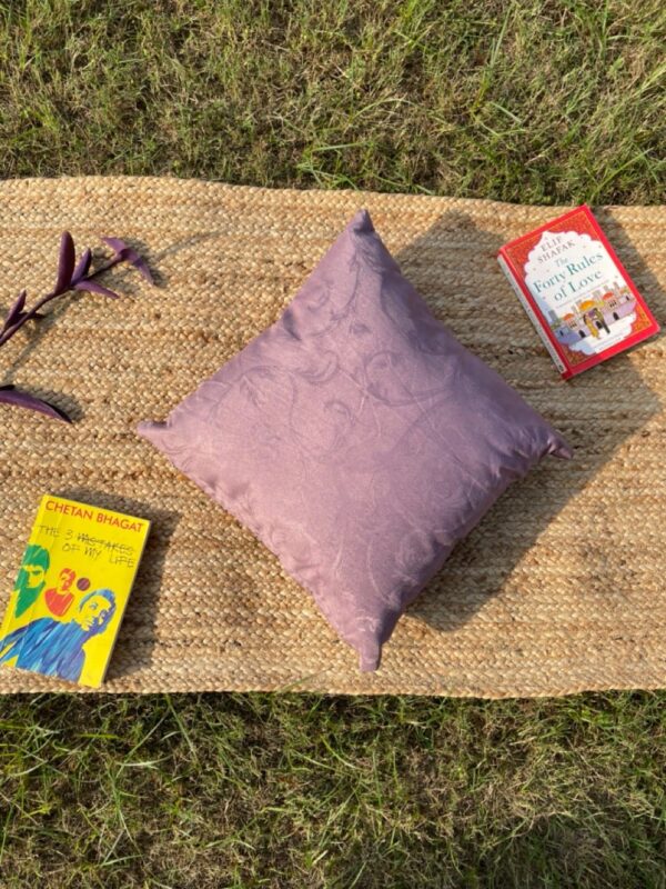 Upcycled cushion made from repurposed fabrics, eco-friendly and sustainable home décor accent piece.