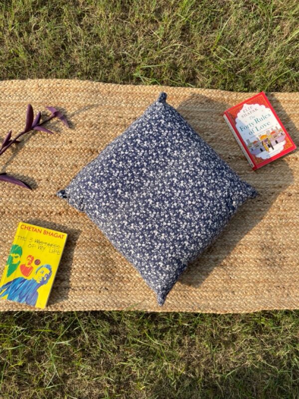 Upcycled cushion made from repurposed fabrics, eco-friendly and sustainable home décor accent piece.