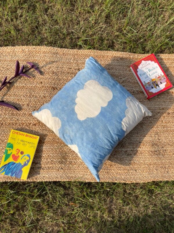 Upcycled cushion made from repurposed fabrics, eco-friendly and sustainable home décor accent piece.