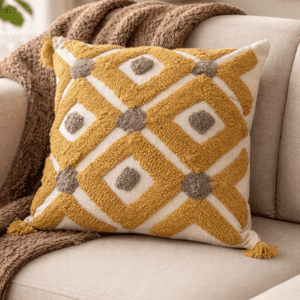 Handcrafted sustainable decorative cushion cover with textured botanical design placed on a neutral sofa in a modern earthy interior