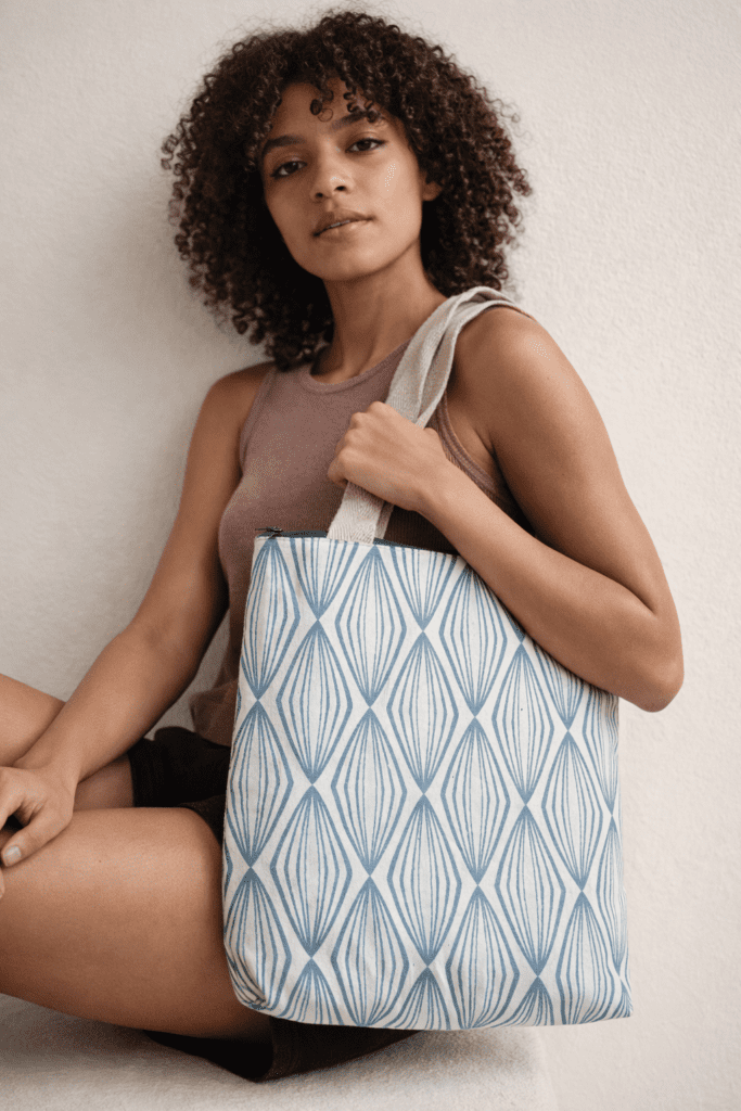 Upcycled tote bag made from recycled fabric, sturdy and spacious, suitable for college, shopping, and everyday use