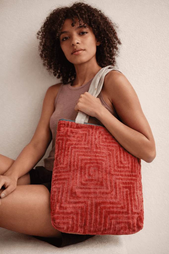 Upcycled tote bag made from recycled fabric, sturdy and spacious, suitable for college, shopping, and everyday use